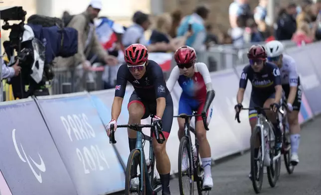 Britain's Sarah Storey, left, competes in the women's C4-5 road race during the 2024 Paralympics, Friday, Sept. 6, 2024, in Clichy-sous-Bois, France. (AP Photo/Aurelien Morissard)