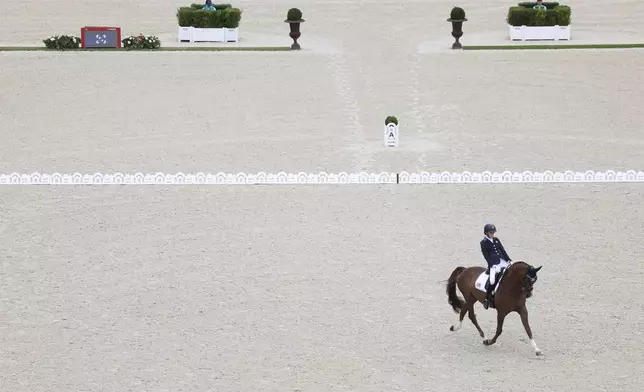 Fiona Howard of the U.S. competes in the equestrian grade II individual event at the Palace of Versailles, taking home the gold medal in her first Paralympic Games at the 2024 Paralympics, Tuesday, Sept. 3, 2024. (AP Photo/Kileigh Kane)