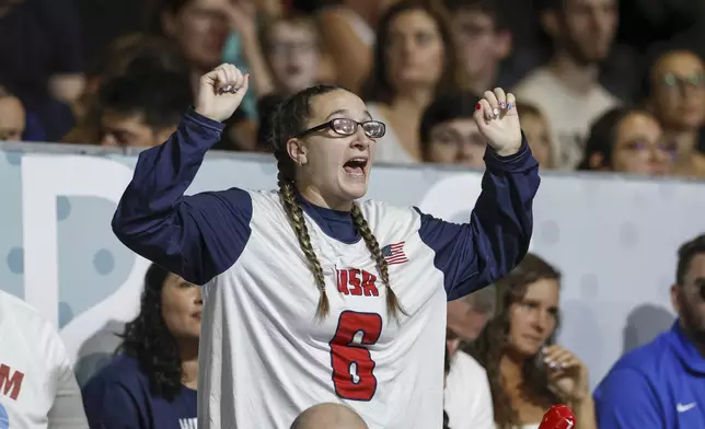 Eliana Mason, fiancé of American goalball team captain Callahan Young, cheers during the mens' United States versus France goalball game during the Paralympic Games in Paris, Saturday, Aug. 31, 2024. (AP Photo/Felix Scheyer)