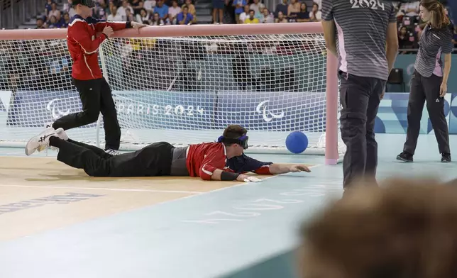 Calahan Young from the U.S. dives for a ball during a 13-8 loss to Brazil on Friday, August 30, 2024 at the South Paris Arena during the Paralympic Games in Paris. (AP Photo/Nathalee Simoneau)