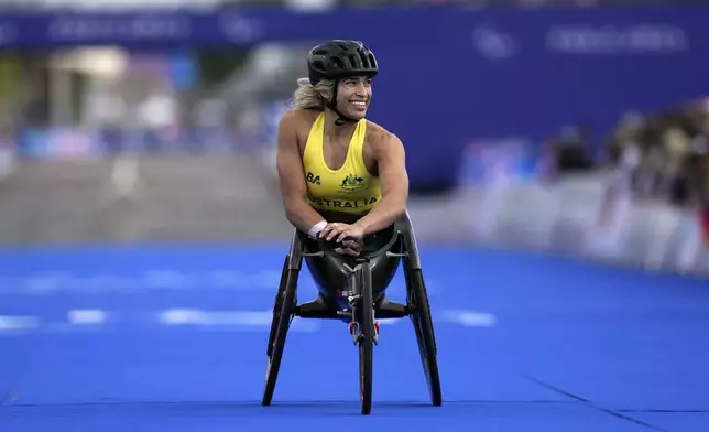 Australia's Madison de Rozario reacts as she wins the silver medal in the women's marathon T54 at the 2024 Paralympics, Sunday, Sept. 8, 2024, in Paris, France. (AP Photo/Thibault Camus)