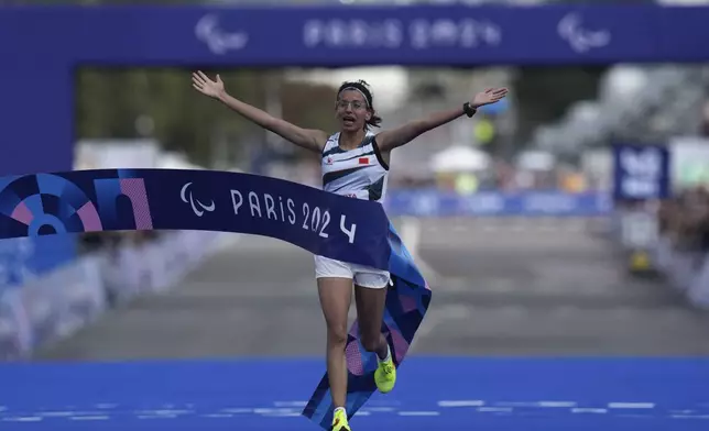 Morocco's Fatima Ezzahra El Idrissi wins the women's marathon T12 at the 2024 Paralympics, Sunday, Sept. 8, 2024, in Paris, France. (AP Photo/Thibault Camus)