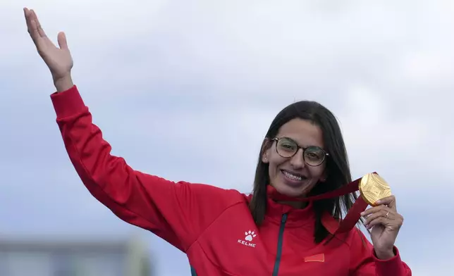 Morocco's Fatima Ezzahra El Idrissi poses with her gold medal after winning the women's marathon T12 at the 2024 Paralympics, Sunday, Sept. 8, 2024, in Paris, France. (AP Photo/Thibault Camus)