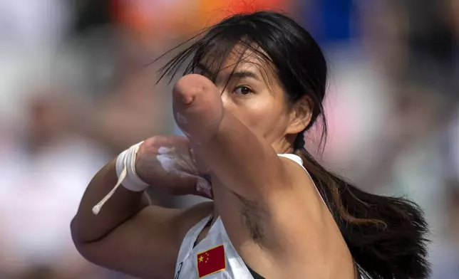 Jiamin Zhang, of China, competes at Women's Shot Put -46 Final, at the Stade de France stadium, during the 2024 Paralympics, Wednesday, Sept. 4, 2024, in Paris, France. (AP Photo/Emilio Morenatti)