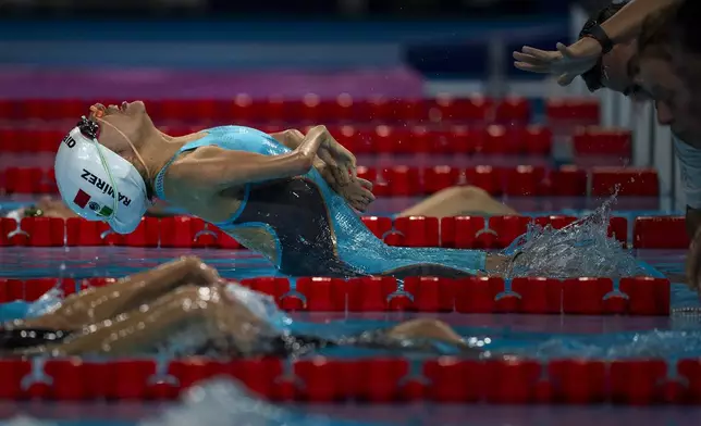 Paralympic athlete Fabiola Ramirez, of Mexico, takes the start at the Women's 100m Backstroke -S2, during a heats swimming serie at the 2024 Paralympics, Thursday, Aug. 29, 2024, in Paris, France. (AP Photo/Emilio Morenatti)