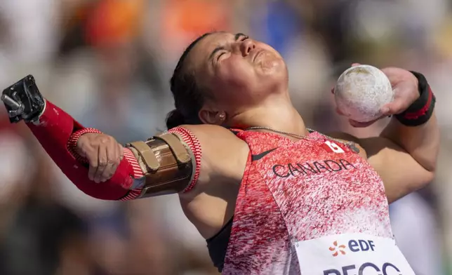 Katie Pegg, of Canada, competes at Women's Shot Put -46 Final, at the Stade de France stadium, during the 2024 Paralympics, Wednesday, Sept. 4, 2024, in Paris, France. (AP Photo/Emilio Morenatti)