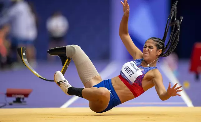 B Hatz, of USA, competes at Women's Long Jump -T64 final at the Stade de France stadium, during the 2024 Paralympics, Saturday, Aug. 31, 2024, in Paris, France. (AP Photo/Emilio Morenatti)