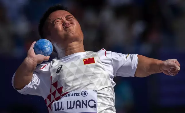 Wei Wang, of China, competes at Men's Shot Put - 40 final, at the Stade de France stadium, during the 2024 Paralympics, Sunday, Sept. 1, 2024, in Paris, France. (AP Photo/Emilio Morenatti)