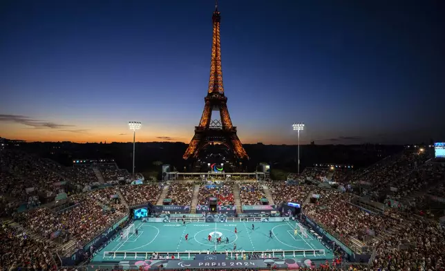 Blind soccer players from France and China compete in a Preliminary Round Group A - Match 4, at the Eiffel Tower Stadium, during the 2024 Paralympics, Sunday, Sept. 1, 2024, in Paris, France. (AP Photo/Emilio Morenatti)