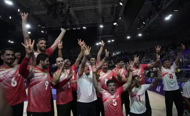 Iran players celebrate after winning the men's Sitting Volleyball Gold Medal Match against Bosnia and Herzegovina, at the 2024 Paralympics, Friday, Sept. 6, 2024, in Paris, France. (AP Photo/Christophe Ena)