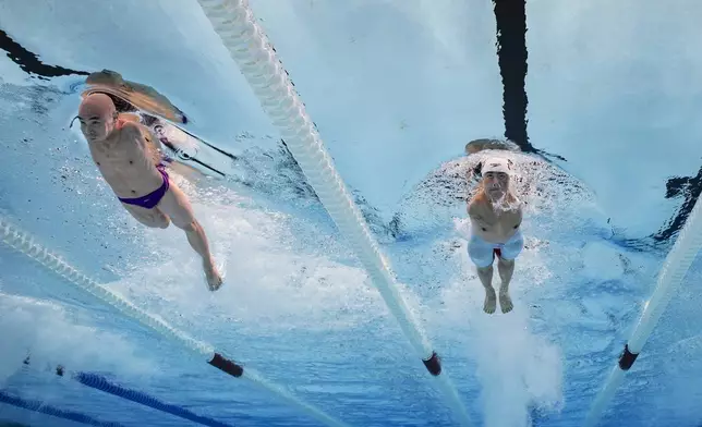 China's Weiyi Yuan, right, and China's Jincheng Guo compete in the Para Swimming Men's 50m Freestyle - S5 Final at the Paris La Defense Arena at the Paris 2024 Paralympic Games, Paris, France, Thursday Sept. 5, 2024. (Joel Marklund/OIS/IOC via AP)