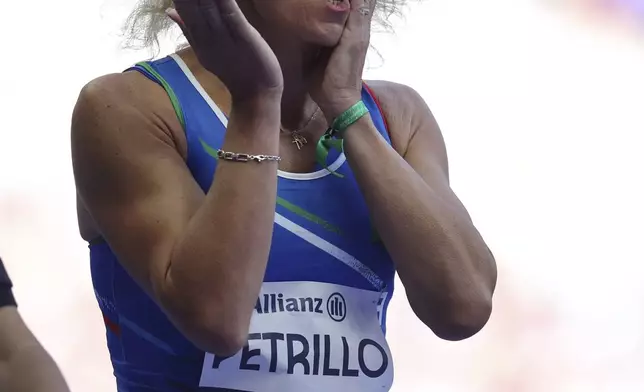 Italy's Valentina Petrillo reacts as she prepares to compete in the women's 400m T12 round 1, at the Stade de France Stadium, during the 2024 Paralympics, Monday, Sept. 2, 2024, in Paris, France. (AP Photo/Jackson Ranger)