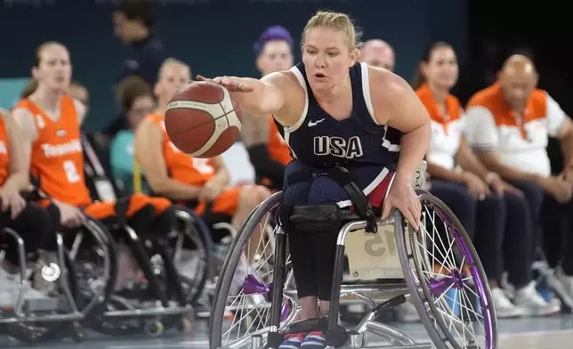 Rose Hollermann of the U.S. in action during the gold medal match of the women's wheelchair basketball between Netherlands and United States, at the 2024 Paralympics, Sunday, Sept. 8, 2024, in Paris, France. (AP Photo/Christophe Ena)