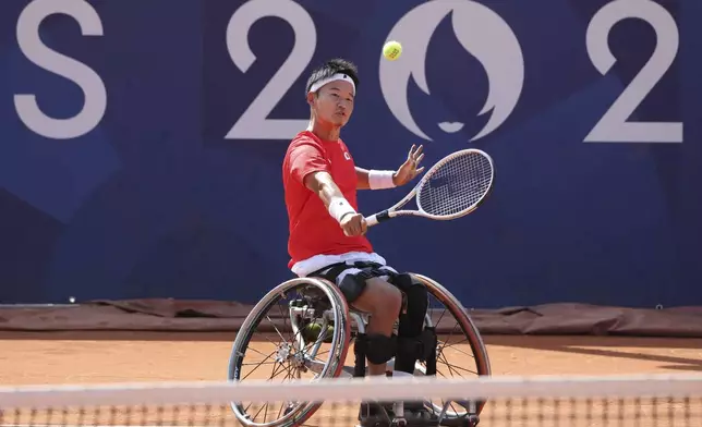 Japan's Takuya Miki competes in the Men's Singles, 3rd round of wheelchair tennis at Roland- Garros Stadium, during the 2024 Paralympics, Monday, Sept. 2, 2024 in Paris, France. (AP Photo/Leighton Smithwick)