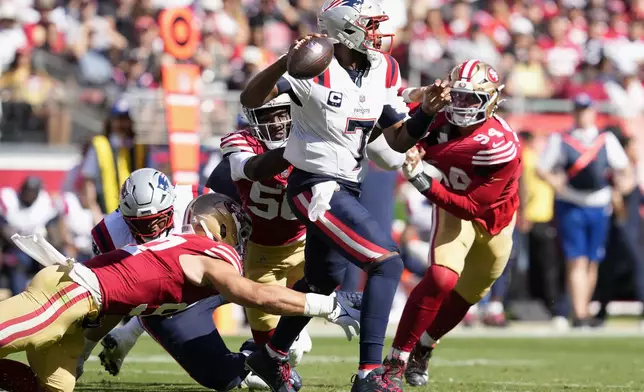 New England Patriots quarterback Jacoby Brissett (7) looks to pass while pressured by San Francisco 49ers defensive end Nick Bosa, bottom, defensive end Leonard Floyd, middle left, and defensive end Yetur Gross-Matos (94) during the second half of an NFL football game in Santa Clara, Calif., Sunday, Sept. 29, 2024. (AP Photo/Godofredo A. Vásquez)