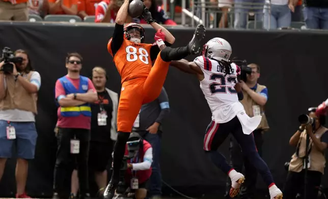 New England Patriots safety Kyle Dugger (23) breaks up a pass intended for Cincinnati Bengals tight end Mike Gesicki (88) during the first half of an NFL football game, Sunday, Sept. 8, 2024, in Cincinnati. (AP Photo/Carolyn Kaster)