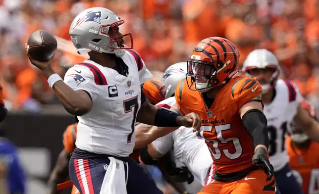 New England Patriots quarterback Jacoby Brissett (7) passes over Cincinnati Bengals linebacker Logan Wilson (55) during the second half of an NFL football game, Sunday, Sept. 8, 2024, in Cincinnati. (AP Photo/Carolyn Kaster)