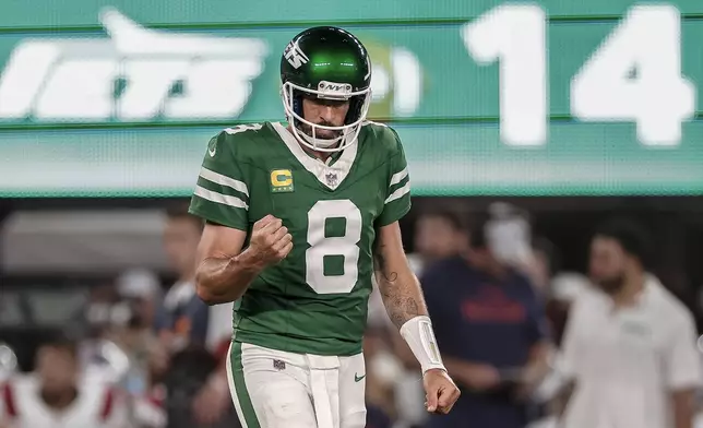 New York Jets quarterback Aaron Rodgers (8) reacts during the third quarter of an NFL football game against the New England Patriots, Thursday, Sept. 19, 2024, in East Rutherford, N.J. (AP Photo/Adam Hunger)