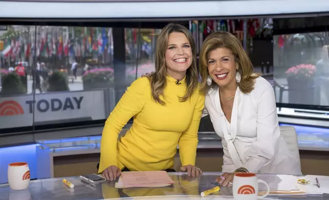 FILE - Co-anchors Savannah Guthrie, left, and Hoda Kotb pose on set of the "Today" show at NBC Studios on Wednesday, June 27, 2018, in New York. (Photo by Charles Sykes/Invision/AP, File)