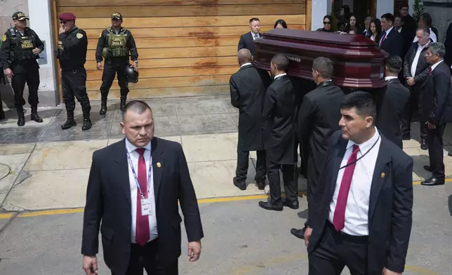 Pallbearers carry the coffin of former President Alberto Fujimori from the home of his daughter Keiko, the day after he died in Lima, Peru, Thursday, Sept. 12, 2024. (AP Photo/Guadalupe Pardo)