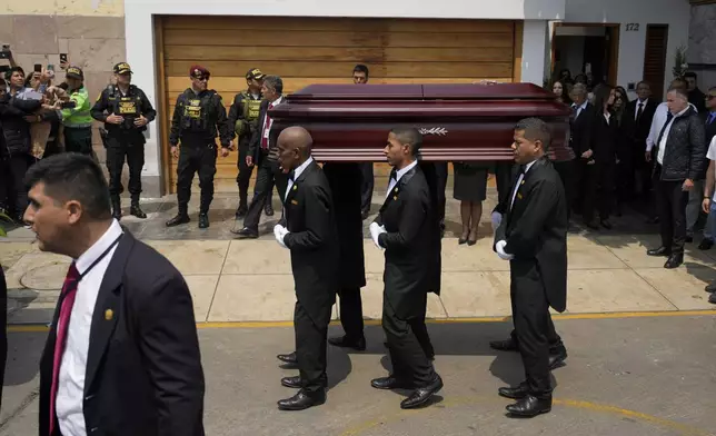 Pallbearers carry the coffin of former President Alberto Fujimori from the home of his daughter Keiko, the day after he died in Lima, Peru, Thursday, Sept. 12, 2024. (AP Photo/Guadalupe Pardo)