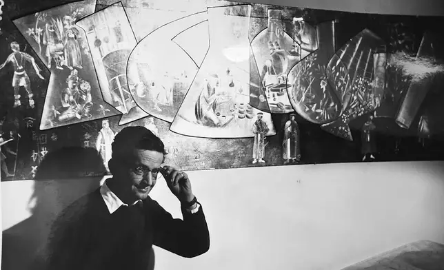 This undated photo shows Nikos Bel-Jon in his New York Studio on East 72 Street in front of a model of the massive metal mural he built for Pfizer's world headquarters in 1961. (Rhea Bel-Jon Calkins via AP)