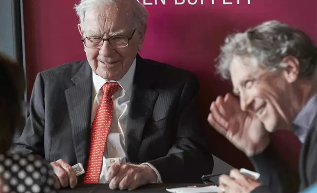 FILE - Warren Buffett, Chairman and CEO of Berkshire Hathaway, left, plays bridge with Bill Gates, following the annual Berkshire Hathaway shareholders meeting on May 5, 2019 in Omaha, Neb. (AP Photo/Nati Harnik, File)