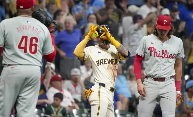 Milwaukee Brewers' Joey Ortiz reacts after hitting an RBI triple during the sixth inning of a baseball game against the Philadelphia Phillies Monday, Sept. 16, 2024, in Milwaukee. (AP Photo/Morry Gash)