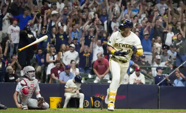 Milwaukee Brewers' Jake Bauers reacts after hitting a walk-off RBI single after a baseball game against the Philadelphia Phillies Wednesday, Sept. 18, 2024, in Milwaukee. (AP Photo/Morry Gash)