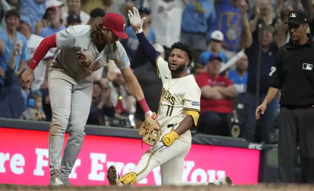 Milwaukee Brewers' Jackson Chourio reacts after hitting a triple during the ninth inning of a baseball game against the Philadelphia Phillies Wednesday, Sept. 18, 2024, in Milwaukee. (AP Photo/Morry Gash)