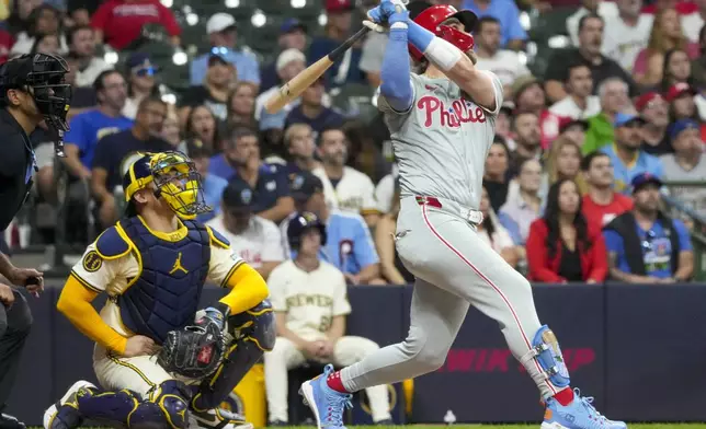 Philadelphia Phillies' Bryce Harper hits a two-run homr run during the sixth inning of a baseball game against the Milwaukee Brewers Tuesday, Sept. 17, 2024, in Milwaukee. (AP Photo/Morry Gash)