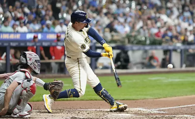 Milwaukee Brewers' Rhys Hoskins hits a home run during the fifth inning of a baseball game against the Philadelphia Phillies Wednesday, Sept. 18, 2024, in Milwaukee. (AP Photo/Morry Gash)