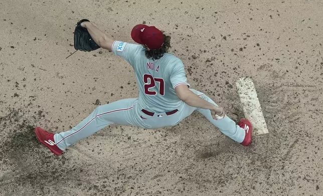 Philadelphia Phillies pitcher Aaron Nola throws during the fifth inning of a baseball game against the Philadelphia Phillies Wednesday, Sept. 18, 2024, in Milwaukee. (AP Photo/Morry Gash)