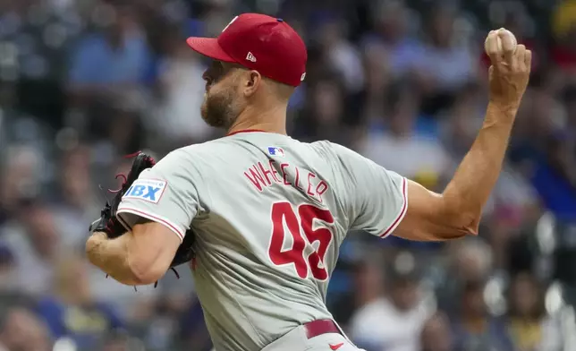 Philadelphia Phillies pitcher Zack Wheeler throws during the first inning of a baseball game against the Milwaukee Brewers Tuesday, Sept. 17, 2024, in Milwaukee. (AP Photo/Morry Gash)