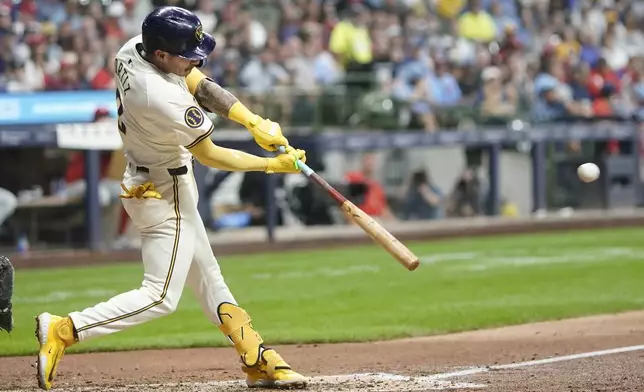 Milwaukee Brewers' Joey Ortiz hits an RBI triple during the sixth inning of a baseball game against the Philadelphia Phillies Monday, Sept. 16, 2024, in Milwaukee. (AP Photo/Morry Gash)