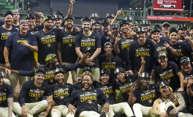 The Milwaukee Brewers celebrate after a baseball game against the Philadelphia Phillies Wednesday, Sept. 18, 2024, in Milwaukee. The Brewers won 2-1 and clinched the National League Central division. (AP Photo/Morry Gash)