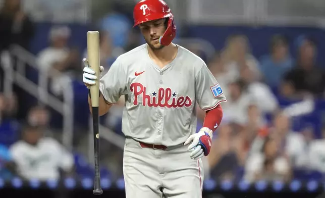 Philadelphia Phillies' Trea Turner walks from the plate after lining out into a double play during the fourth inning of a baseball game against the Miami Marlins, Sunday, Sept. 8, 2024, in Miami. (AP Photo/Lynne Sladky)