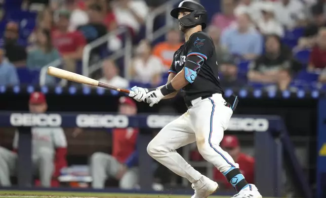 Miami Marlins' Connor Norby watches his single during the fourth inning of a baseball game against the Philadelphia Phillies, Friday, Sept. 6, 2024, in Miami. (AP Photo/Lynne Sladky)