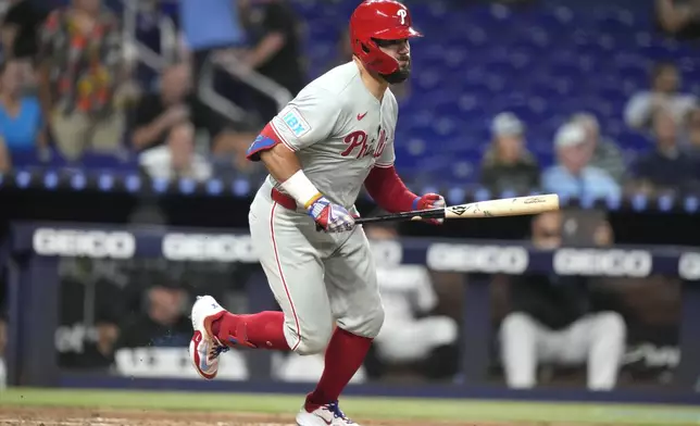 Philadelphia Phillies' Kyle Schwarber runs after hitting a double during the third inning of a baseball game against the Miami Marlins, Thursday, Sept. 5, 2024, in Miami. (AP Photo/Lynne Sladky)