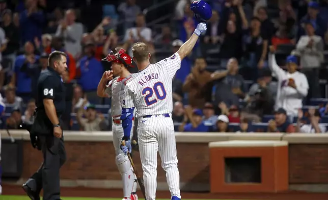 New York Mets batter Pete Alonso waves to the fans as he steps to the plate in the first inning during a baseball game against the Philadelphia Phillies, Sunday, Sept. 22, 2024, in New York. (AP Photo/John Munson)