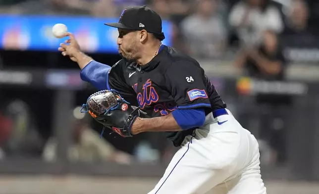 New York Mets' Edwin Díaz pitches during the ninth inning of a baseball game against the Philadelphia Phillies, Thursday, Sept. 19, 2024, in New York. (AP Photo/Frank Franklin II)