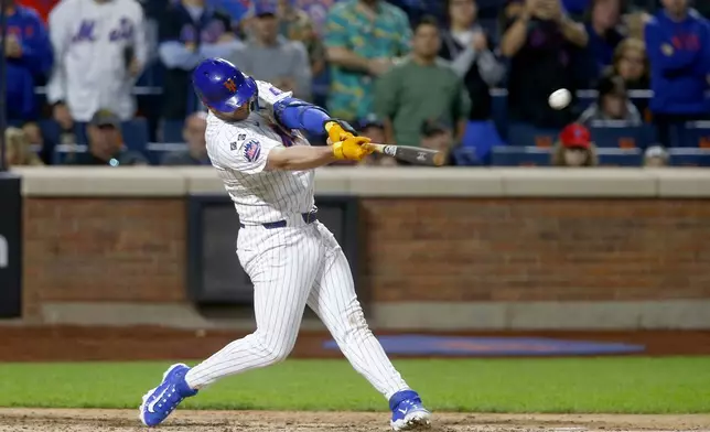 New York Mets' Pete Alonso hit a long foul ball in the eighth inning during a baseball game against the Philadelphia Phillies, Sunday, Sept. 22, 2024, in New York. (AP Photo/John Munson)