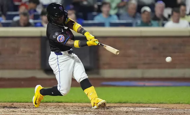 New York Mets' Luisangel Acuña grounds into a force out during the fifth inning of a baseball game against the Philadelphia Phillies, Thursday, Sept. 19, 2024, in New York. Acuña was safe at first base on the play. (AP Photo/Frank Franklin II)