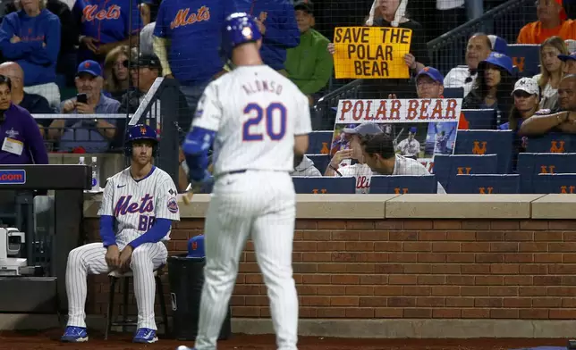 New York Mets' Pete Alonso walks back to the dugout after striking out in the first inning during a baseball game against the Philadelphia Phillies, Sunday, Sept. 22, 2024, in New York. (AP Photo/John Munson)