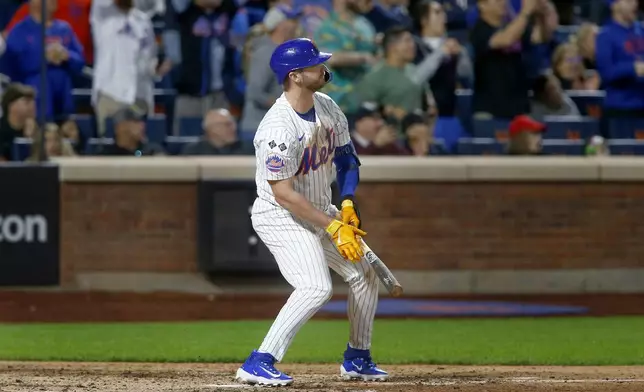 New York Mets' Pete Alonso watches his long fly ball go foul in the eighth inning during a baseball game against the Philadelphia Phillies, Sunday, Sept. 22, 2024, in New York. (AP Photo/John Munson)