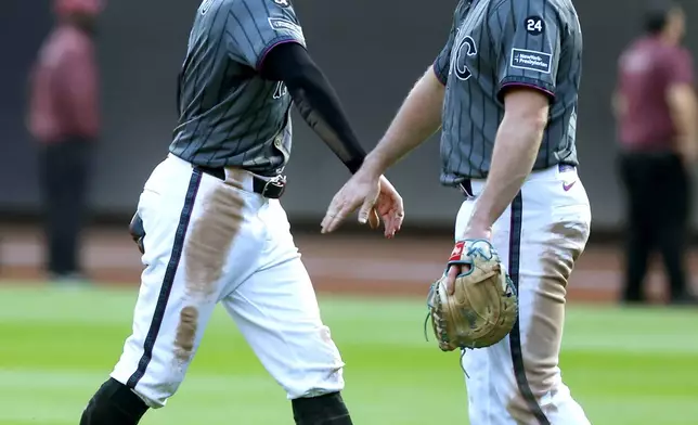 New York Mets outfielder Brandon Nimmo, left, and first baseman Pete Alonso, right, celebrate after defeating the Philadelphia Phillies in a baseball game, Saturday, Sept. 21, 2024, in New York. (AP Photo/Noah K. Murray)