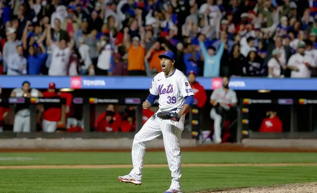 New York Mets relief pitcher Edwin Diaz reacts after striking out Kody Clemens for the final out during a baseball game against the Philadelphia Phillies, Sunday, Sept. 22, 2024, in New York. (AP Photo/John Munson)