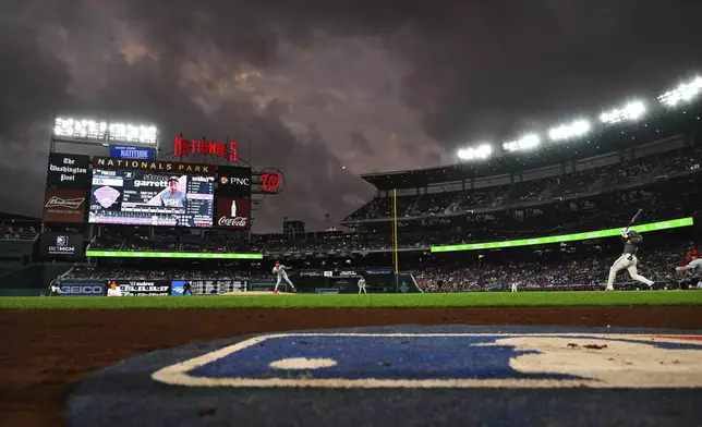 Washington Nationals' Stone Garrett hits a home run against Philadelphia Phillies pitcher Ranger Suárez during the first inning of a baseball game, Friday, Sept. 27, 2024, in Washington. (AP Photo/Terrance Williams)