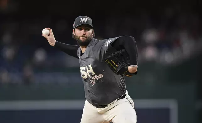 Washington Nationals pitcher Trevor Williams throws during the first inning of a baseball game against the Philadelphia Phillies, Friday, Sept. 27, 2024, in Washington. (AP Photo/Terrance Williams)