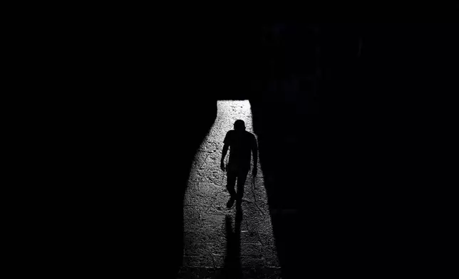 A visitor walks through the interior of the Anahuacalli Museum in Mexico City, Tuesday, Aug. 20, 2024. (AP Photo/Eduardo Verdugo)